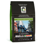A package of Terra Coffee Club Montreal Blend Coffee, showing a graphic of coffee beans and a cityscape, indicating medium to dark roast.